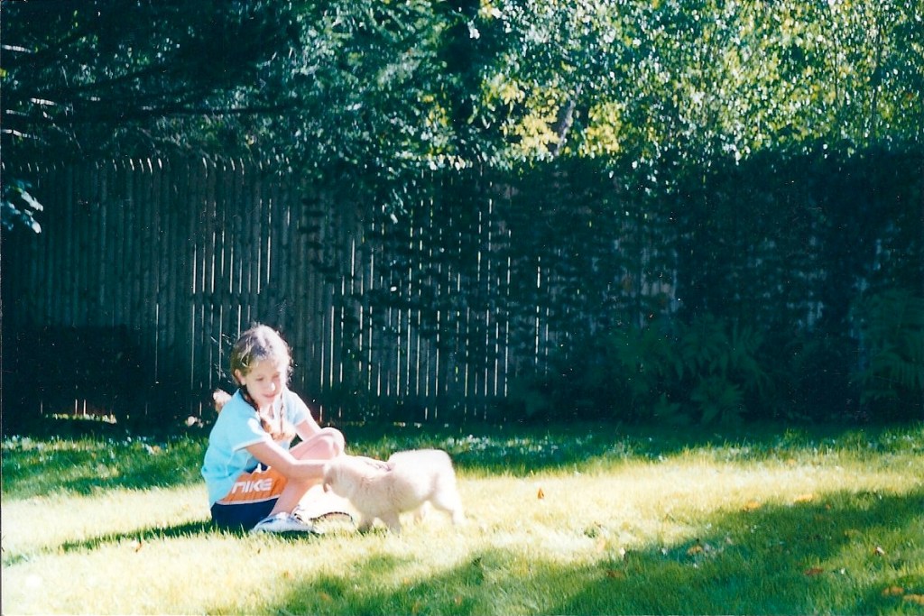girl and golden retriever